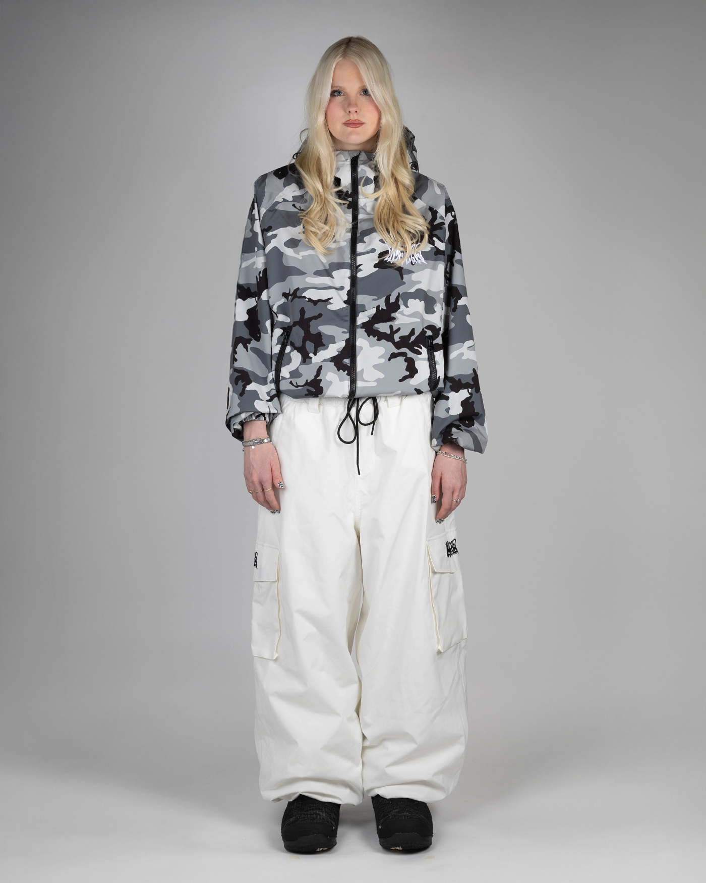 Winter Camo Baggy Snowpants full front view on a woman (she's 175cm wearing size L)
