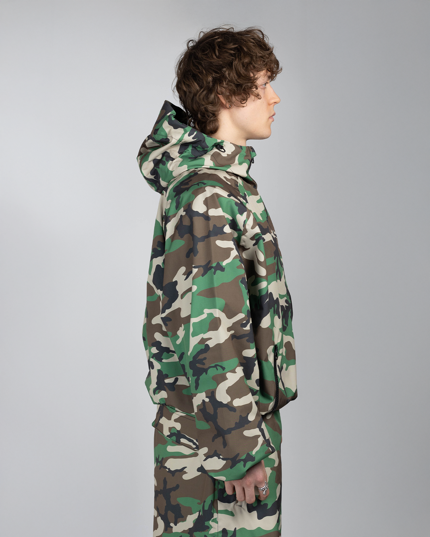 Camo snow jacket side view on model