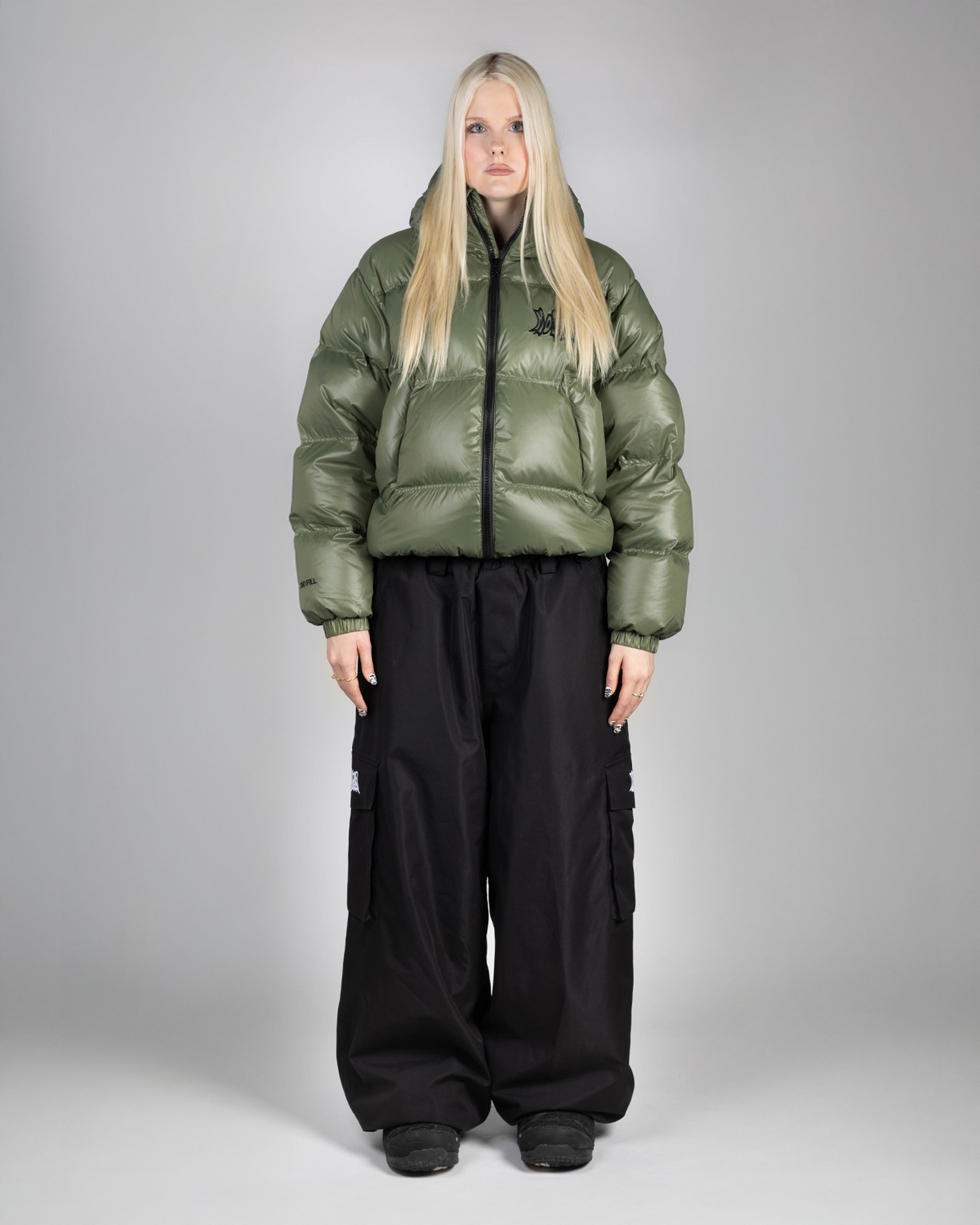 Green puffer front view on woman (She's 175cm wearing size M)