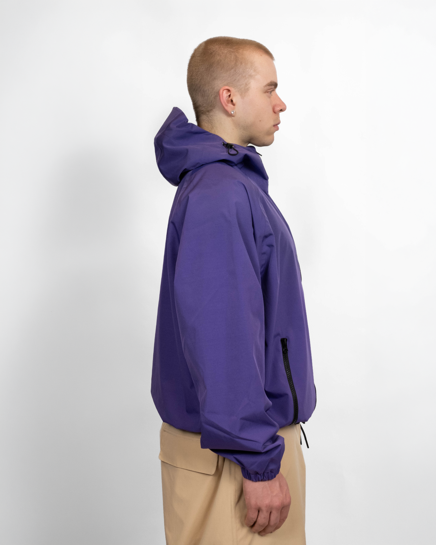 Purple snow jacket side view on model 